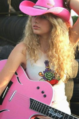 does taylor swift really play guitar on stage does she only use a pre-recorded version?